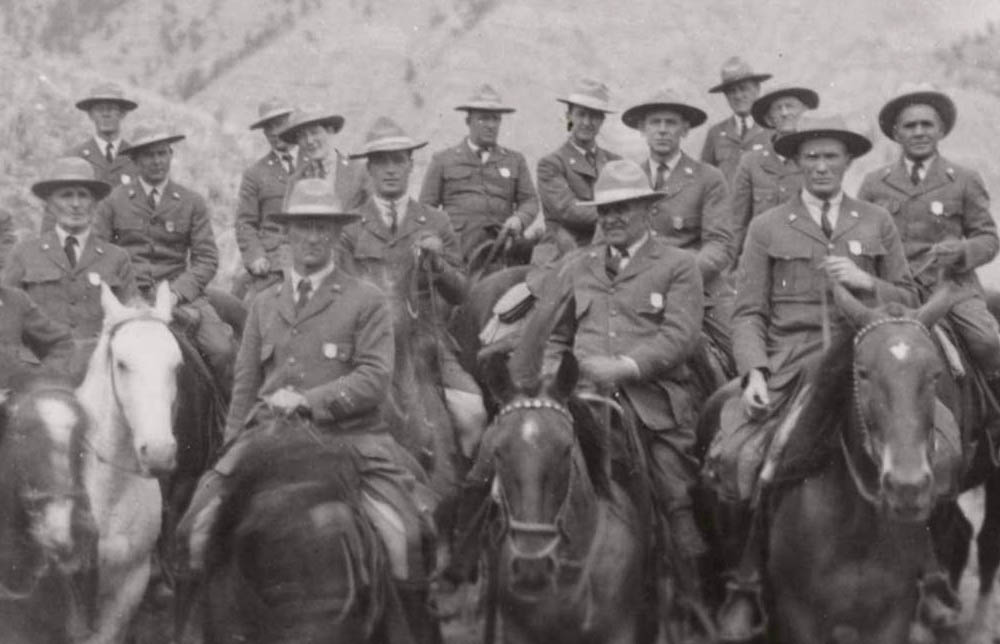 Fifteen rangers on horseback. Superintendent Horace M. Albright is on the far left.
